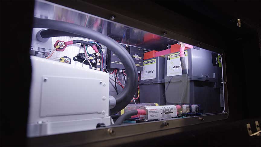 Compartment of Keystone Montana fifth-wheel with lithium batteries and power management equipment