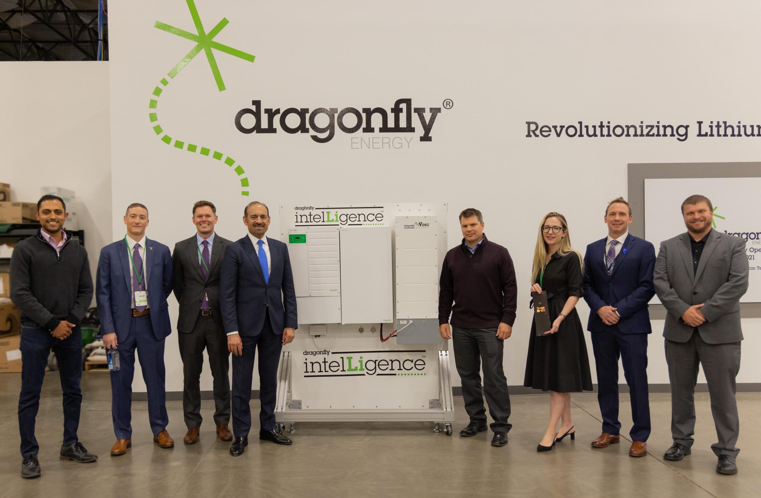 Dragonfly Energy's leadership team posed witha Dragonfly IntelLigence product