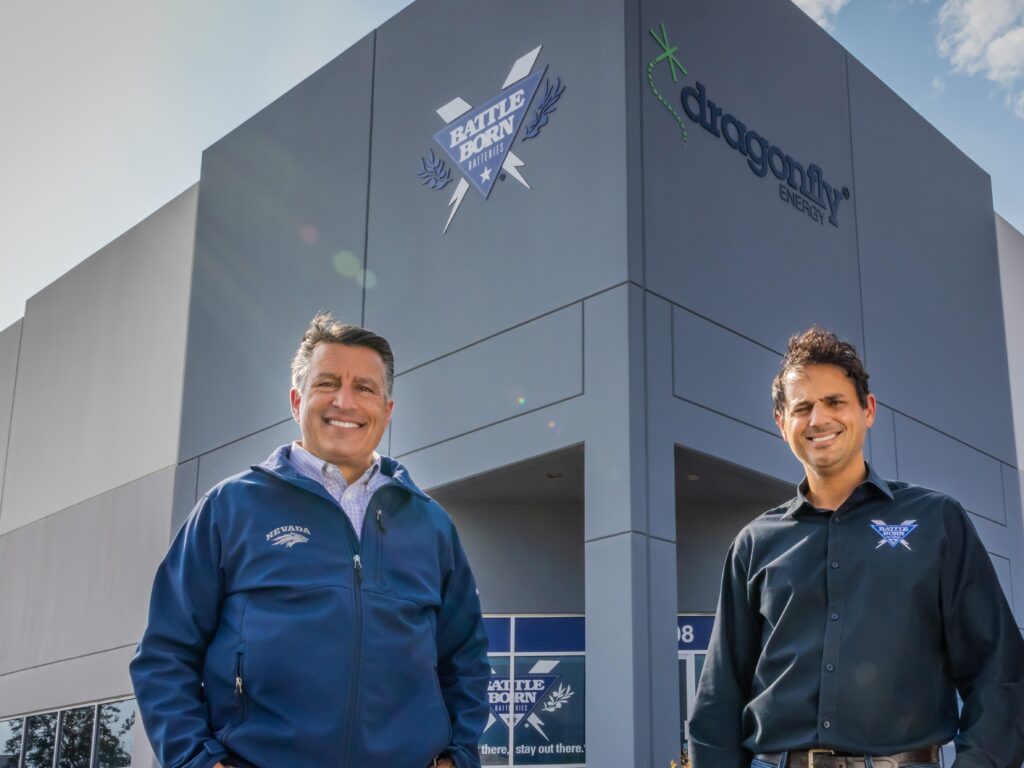 Bryan Sandoval, University of Nevada, Reno President and former governer, standing next to CEO of Dragonfly Energy Denis Phares in front of Dragonfly Energy Headquarters in Reno, Nevada
