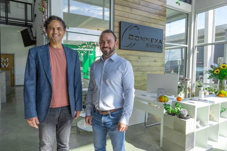 CEO of Dragonfly Energy smiling standing next to Michael Postel, Founder and President of Connexa smiling. The two are standing in Connexa's headquarters