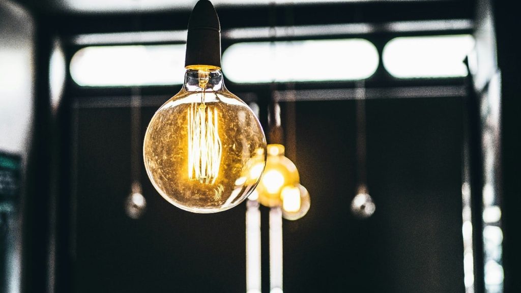 lightbulbs hanging in a room providing light