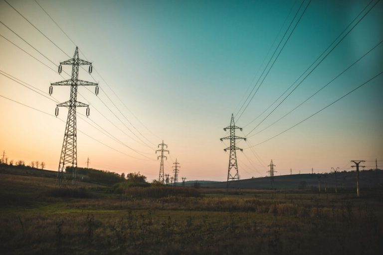 Power lines stretching across a desert